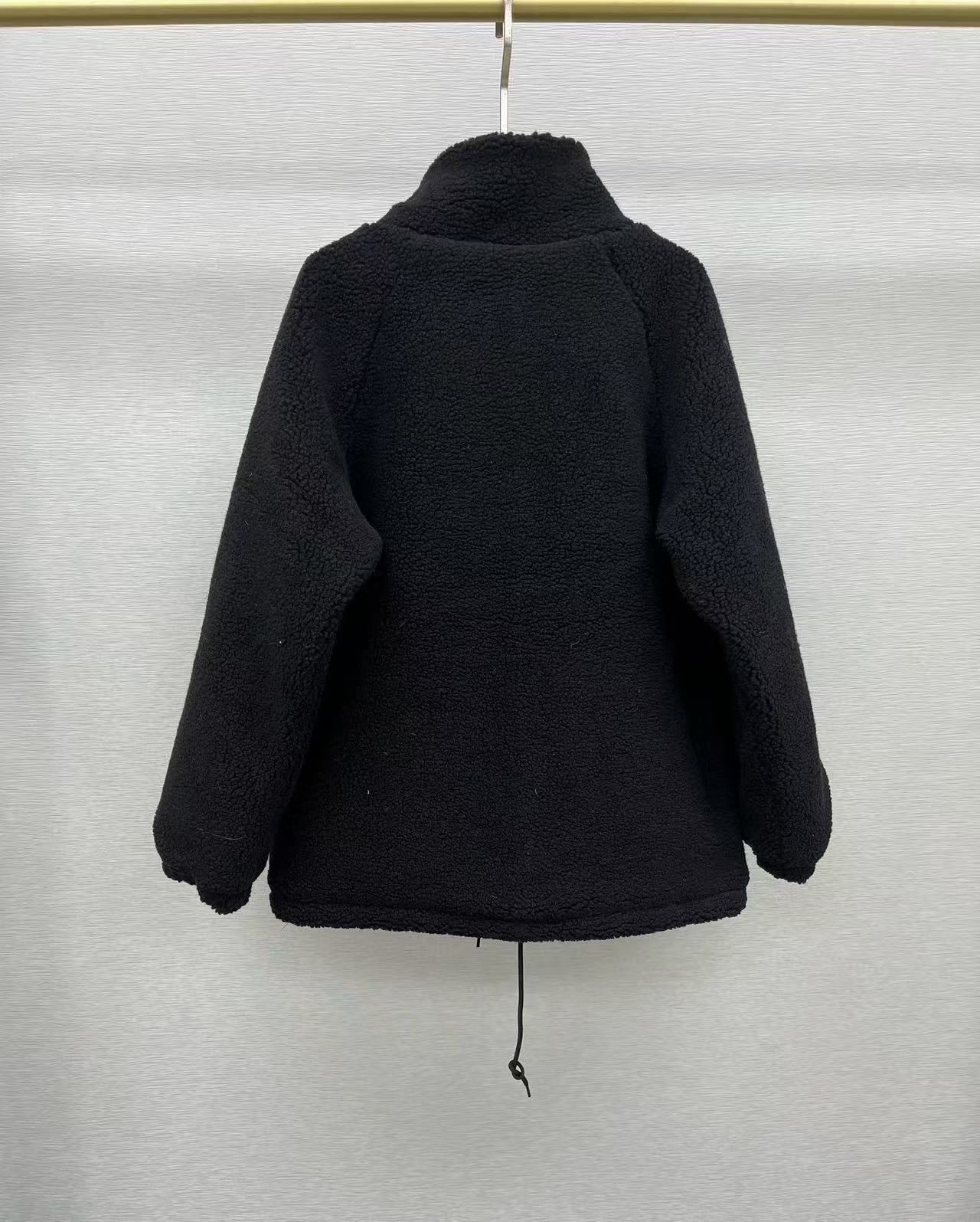 Veste matelassée en laine d'agneau noire avec poche