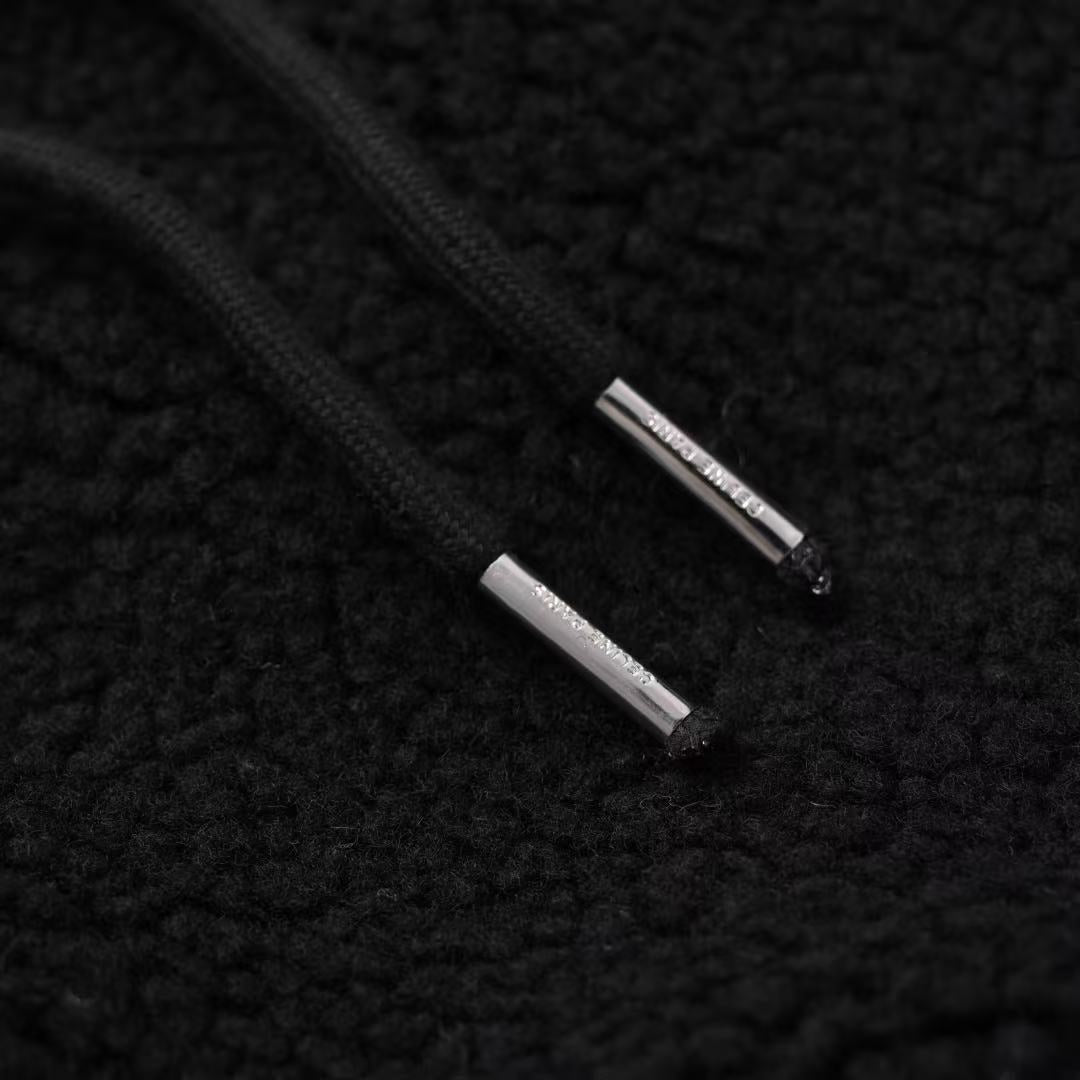 Veste matelassée en laine d'agneau noire avec poche