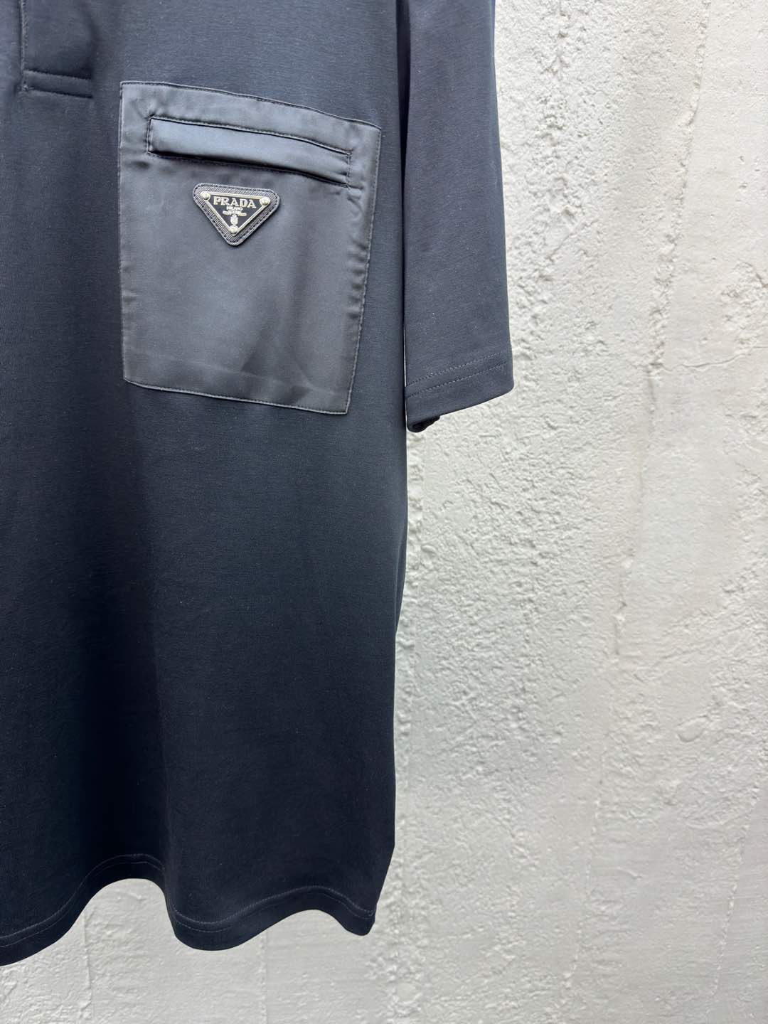 Polo à poche zippée