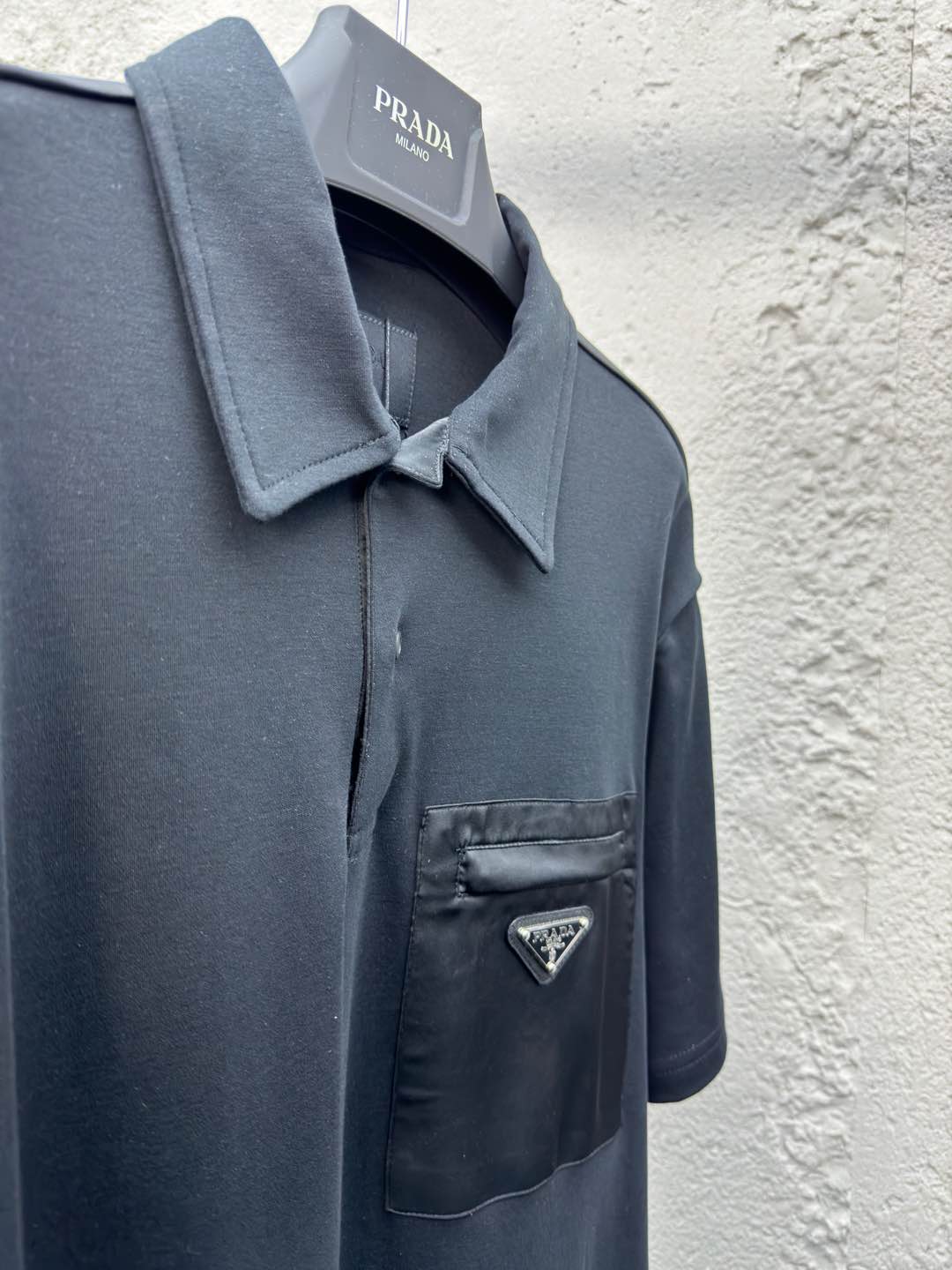 Polo à poche zippée
