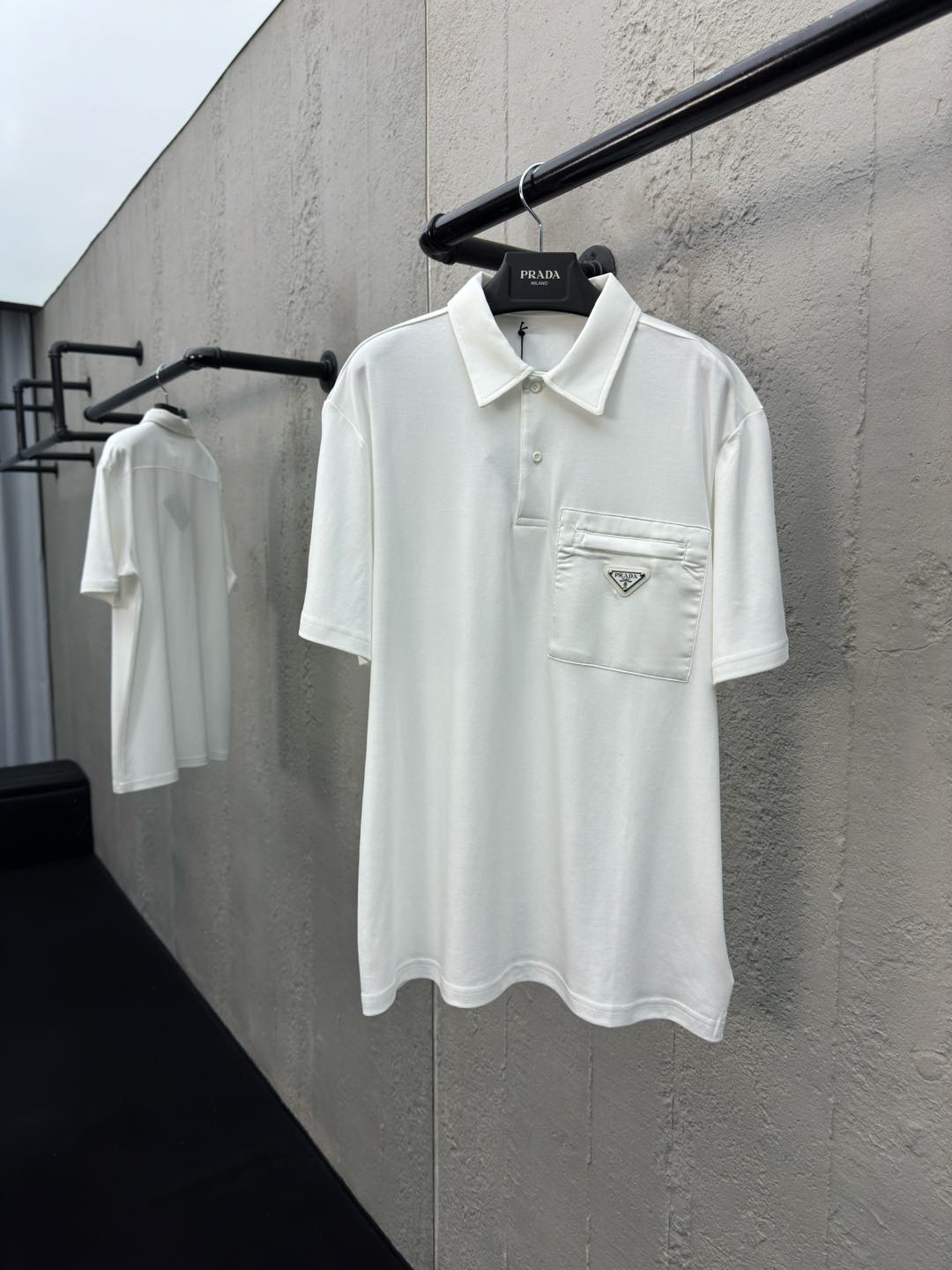 Polo à poche zippée