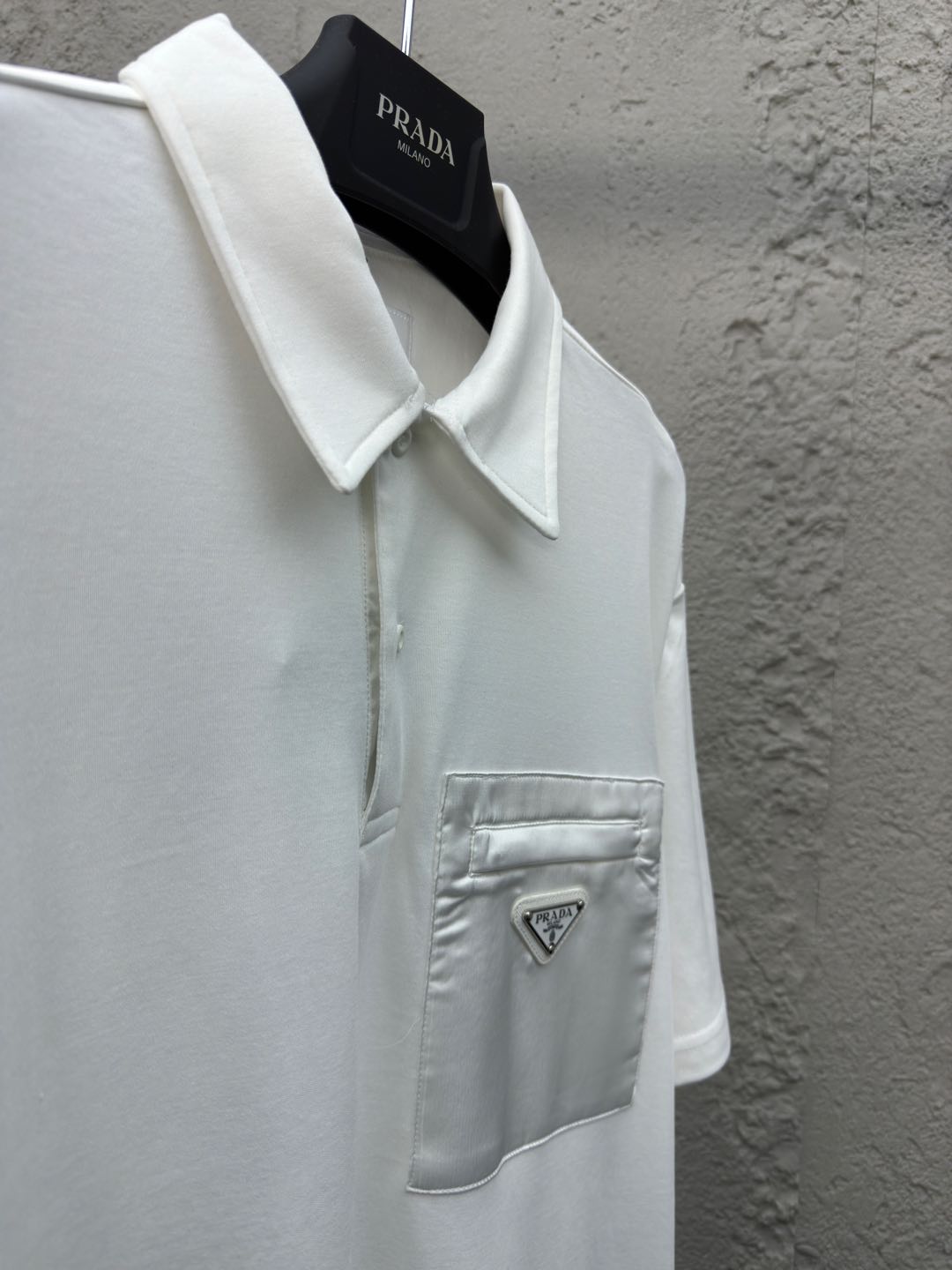 Polo à poche zippée
