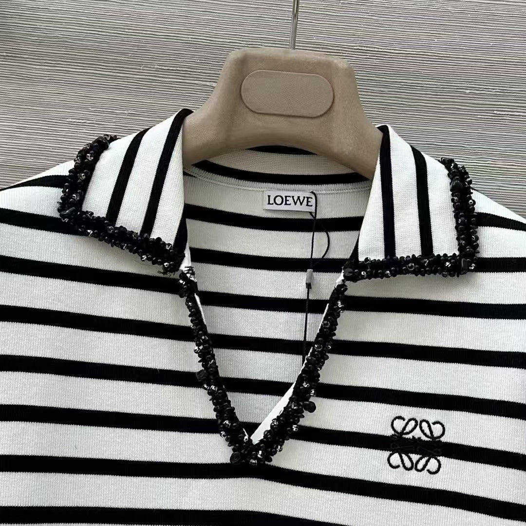 Polo rayé en tricot à manches courtes