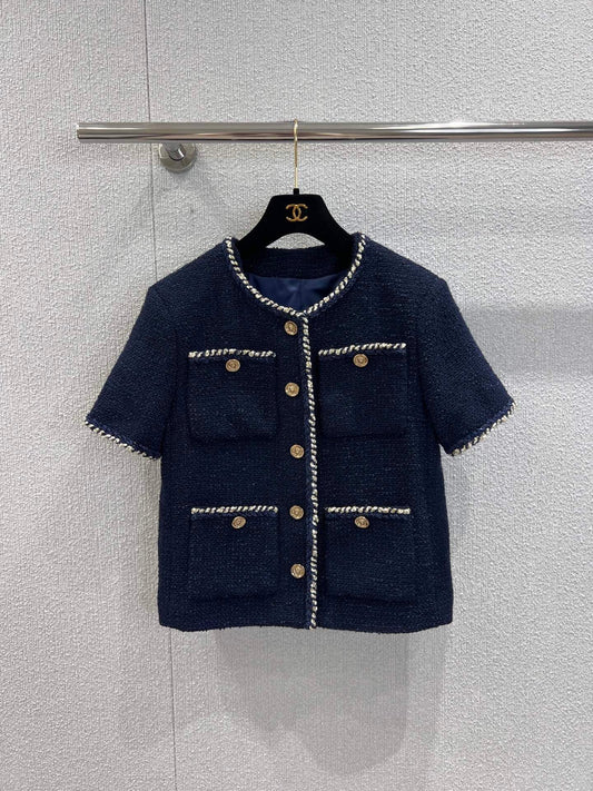 Veste bouclée à manches courtes et ourlet à bande